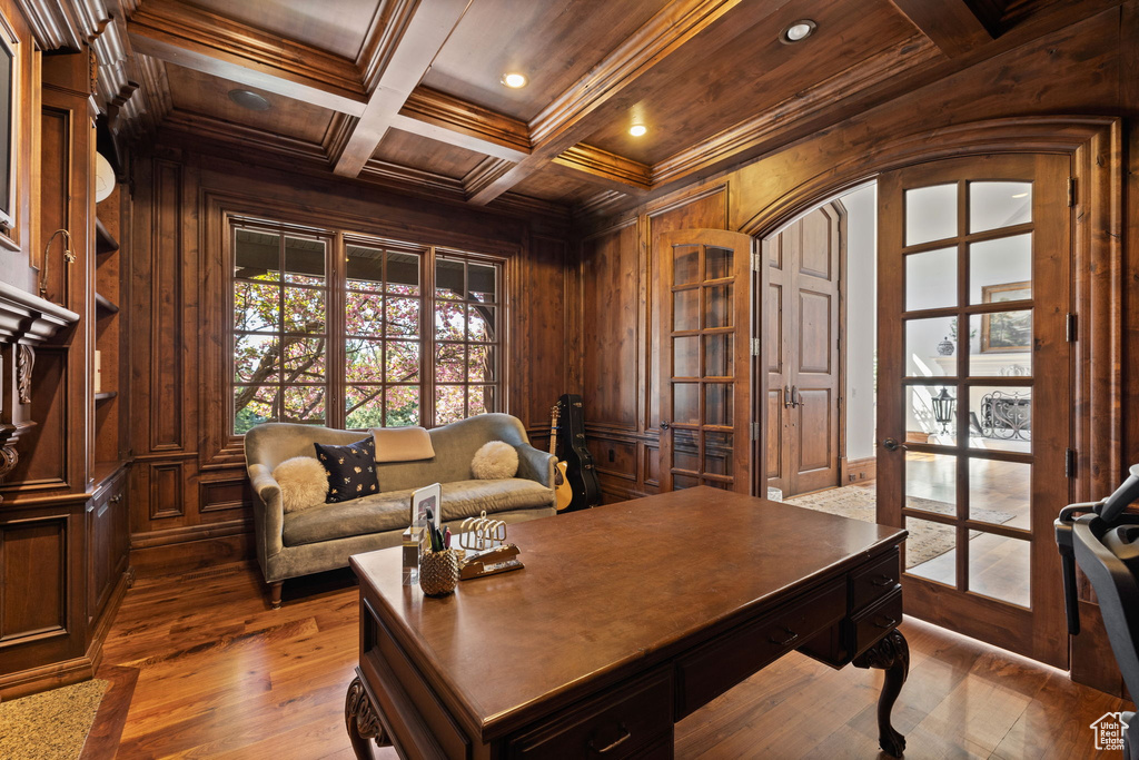 Office space with wood walls, hardwood / wood-style floors, recessed lighting, wooden ceiling, and beamed ceiling
