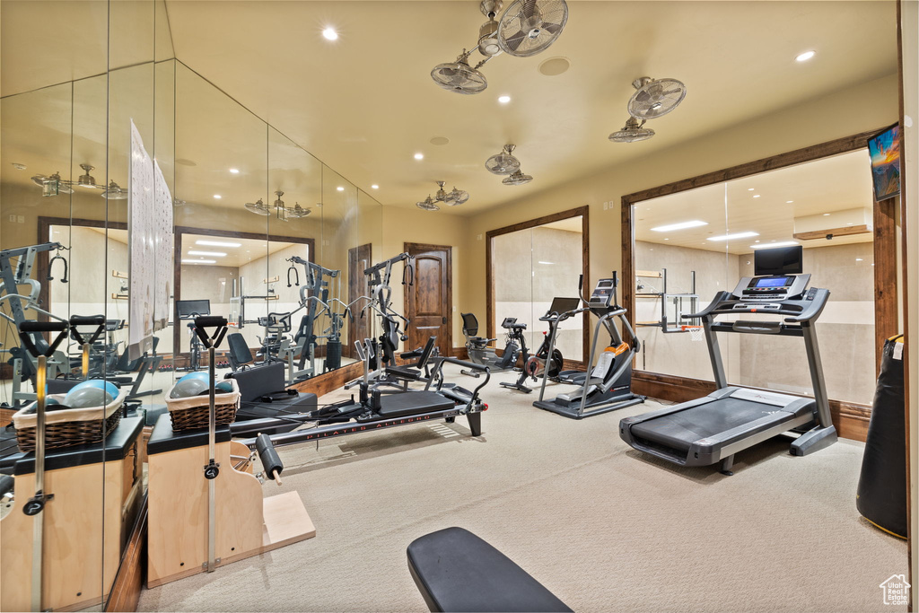 Exercise room featuring recessed lighting and carpet floors