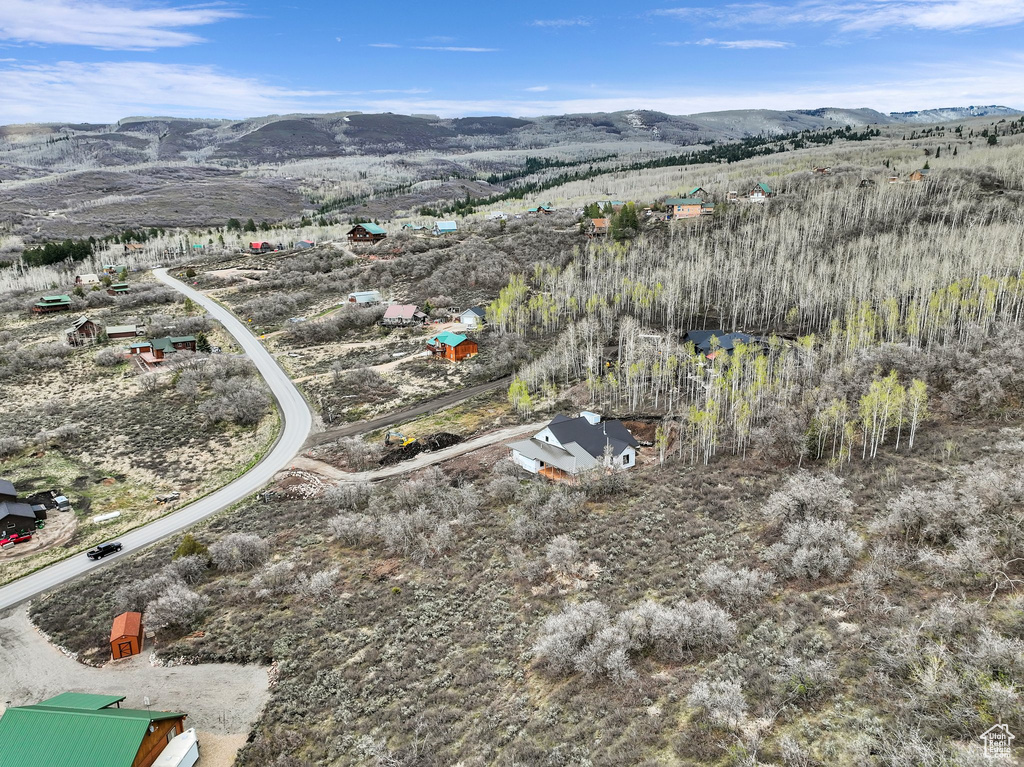 Aerial overview of property\'s location with mountains