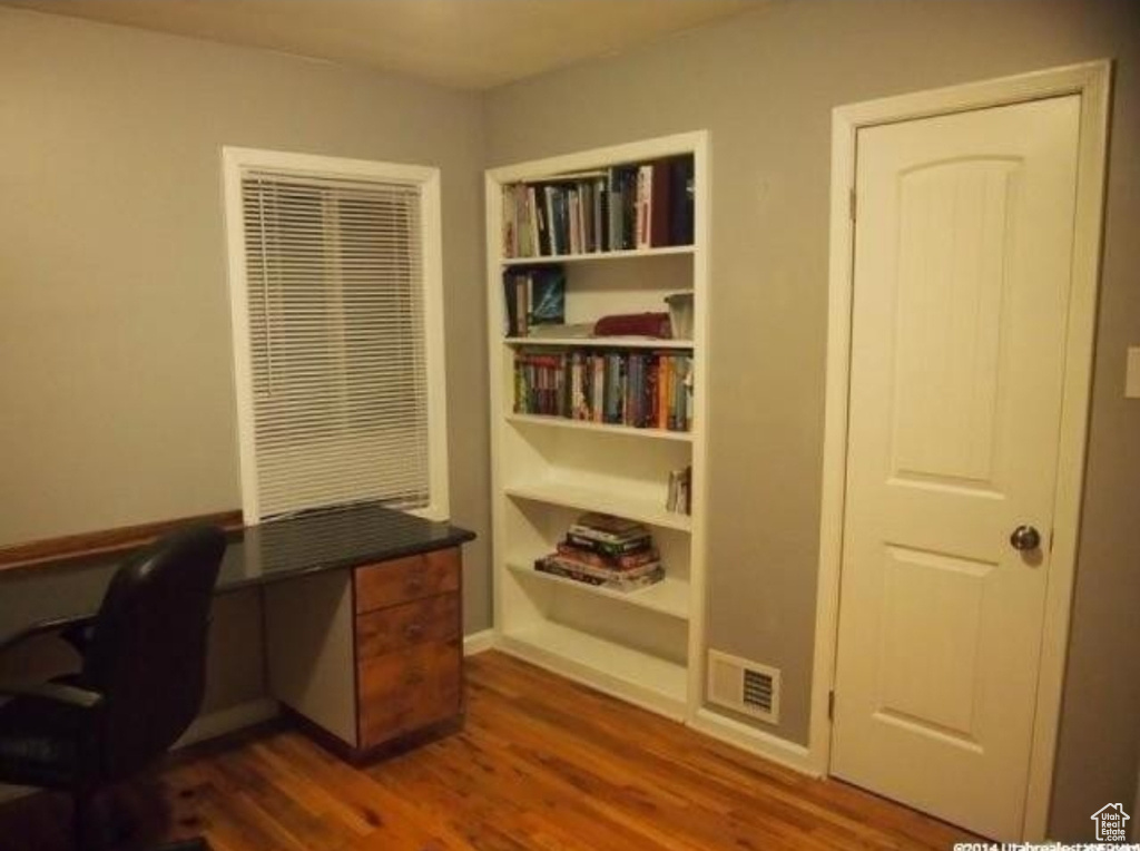 Office area with dark wood finished floors