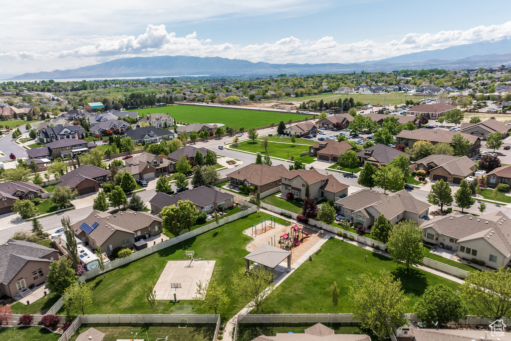 Aerial perspective of suburban area with a mountainous background