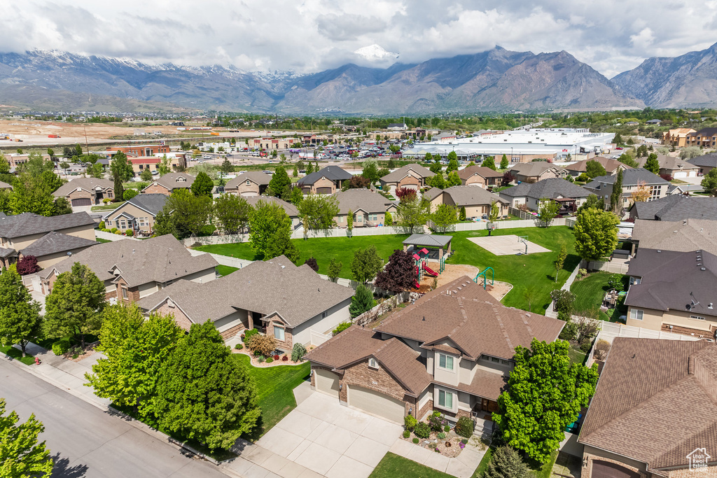 Aerial view of residential area with a mountainous background