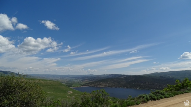 Mountain view featuring a large body of water