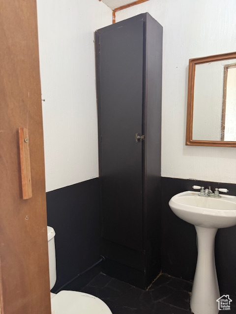 Half bath featuring toilet