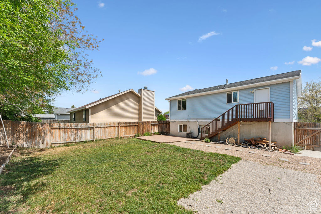 Back of property with a patio area