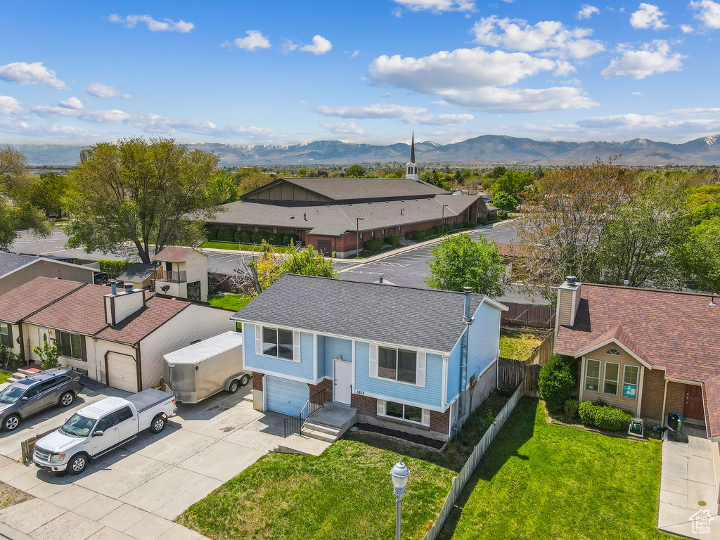 Aerial perspective of suburban area with a mountain backdrop