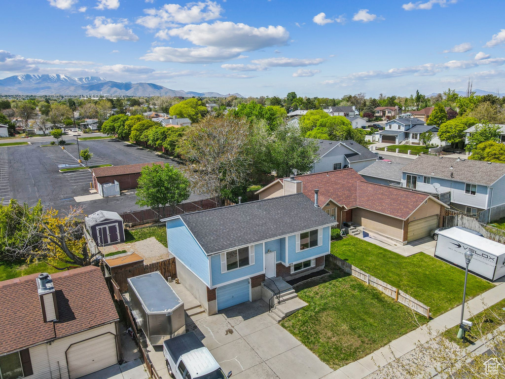 Aerial perspective of suburban area with a mountainous background