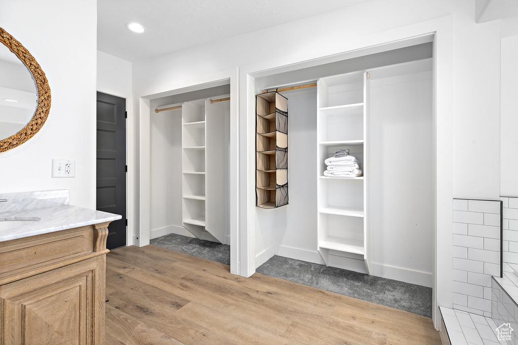 Interior space with a sink and light wood-style flooring