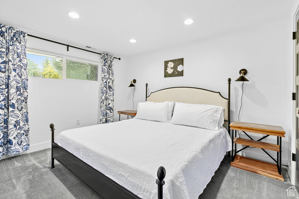 Bedroom featuring carpet floors, baseboards, and recessed lighting