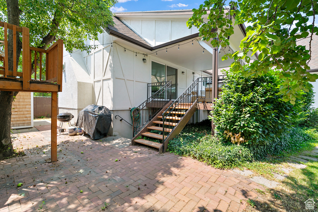 Exterior space with a patio area and stairs