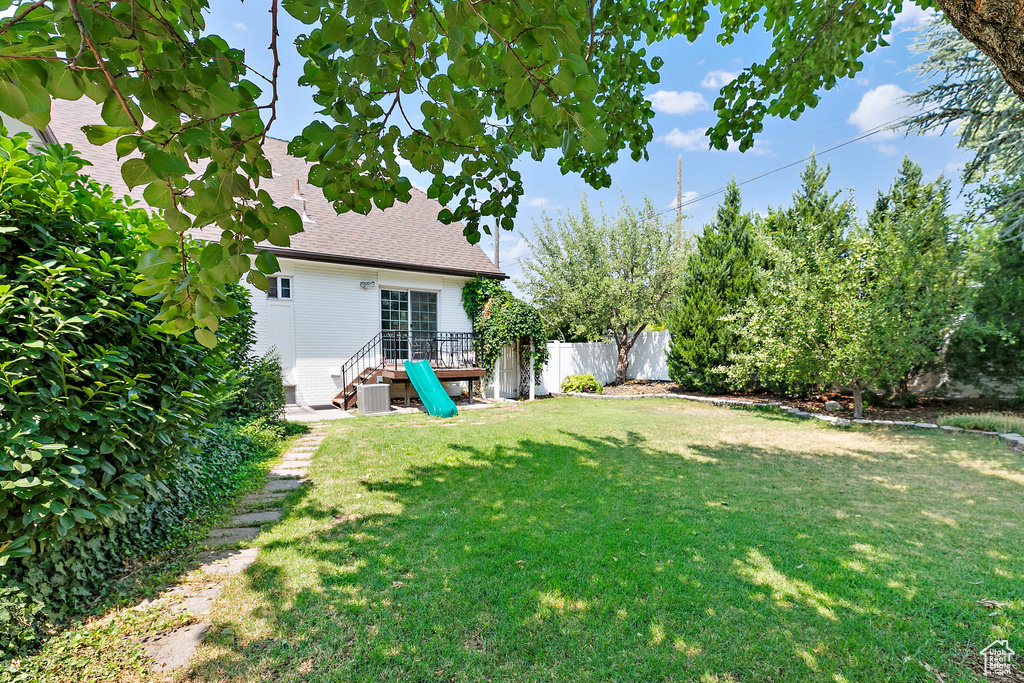 View of yard featuring fence