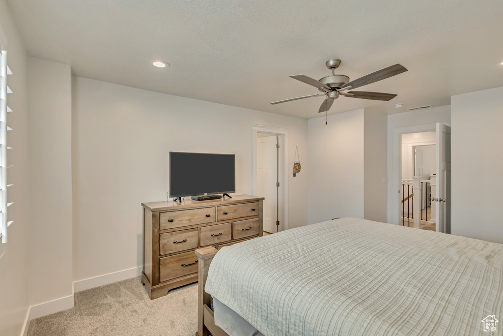 Bedroom with baseboards, light carpet, recessed lighting, and ceiling fan