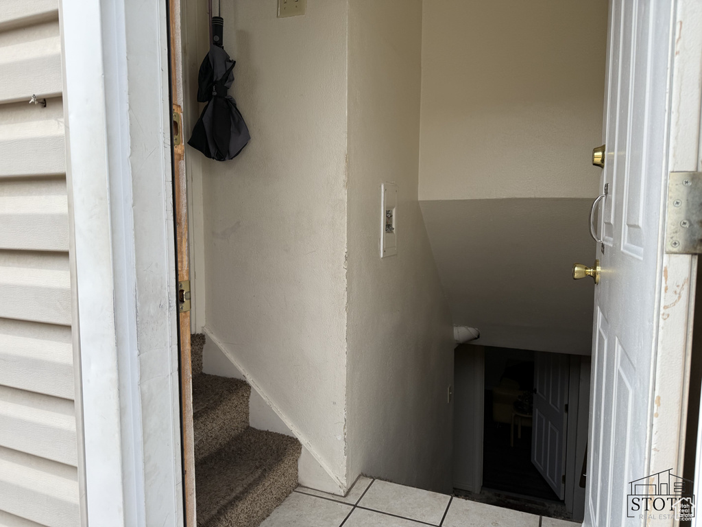 Staircase featuring tile patterned flooring