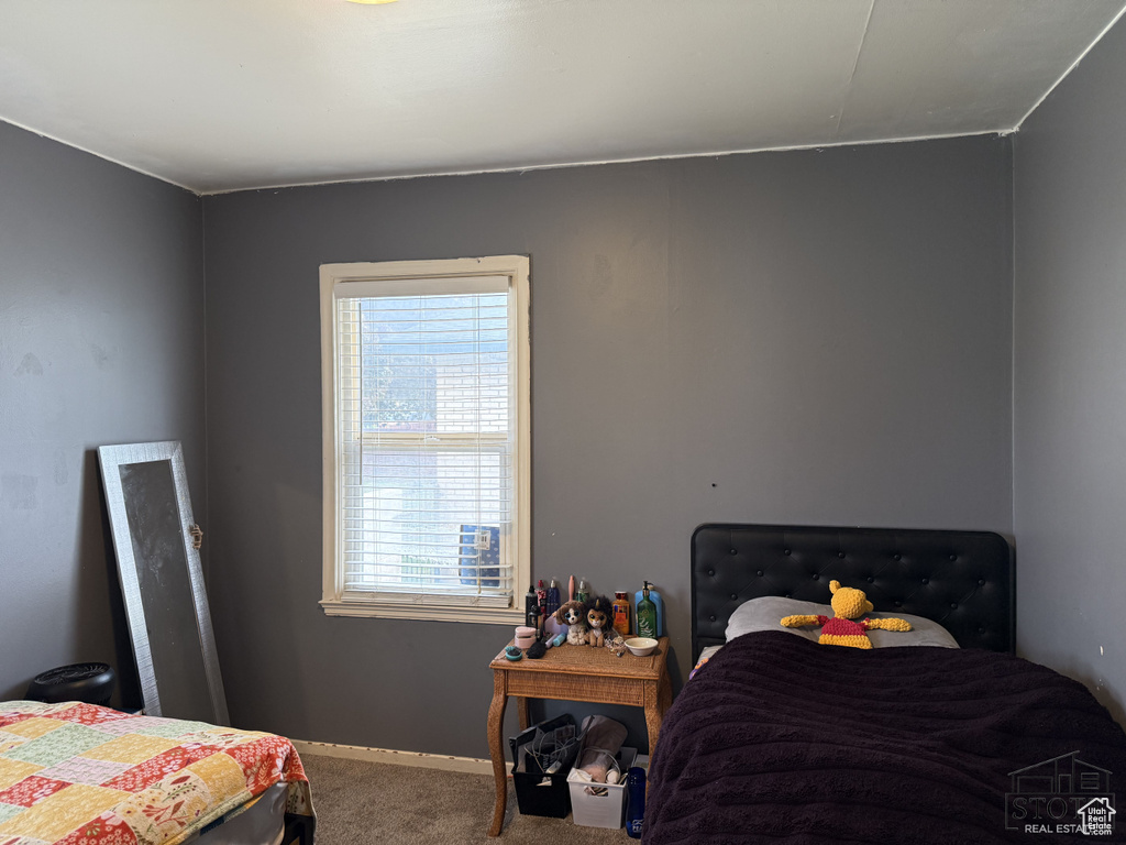 Carpeted bedroom with baseboards