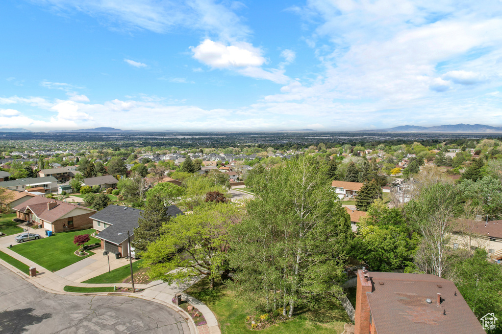 Aerial perspective of suburban area with a mountainous background