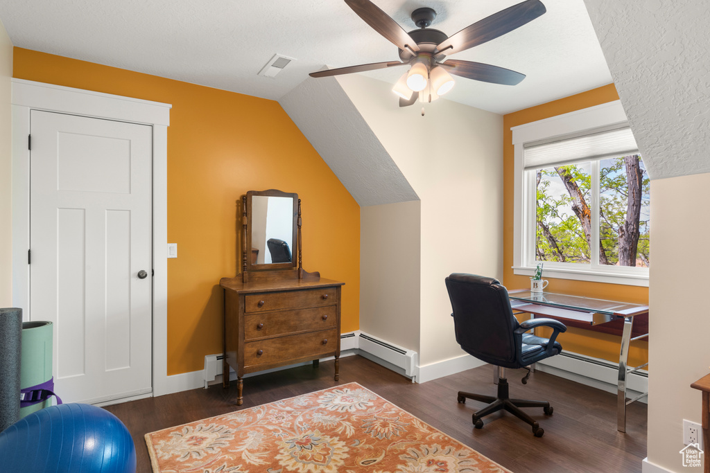Office area with a baseboard heating unit, dark wood-style floors, a ceiling fan, a baseboard radiator, and lofted ceiling
