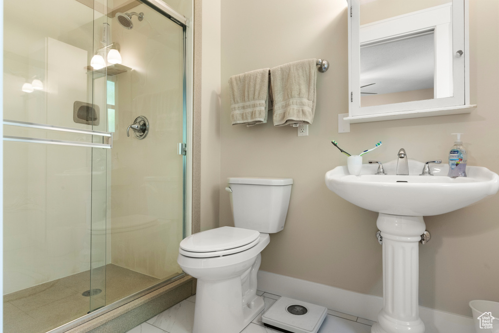 Bathroom with toilet and a stall shower
