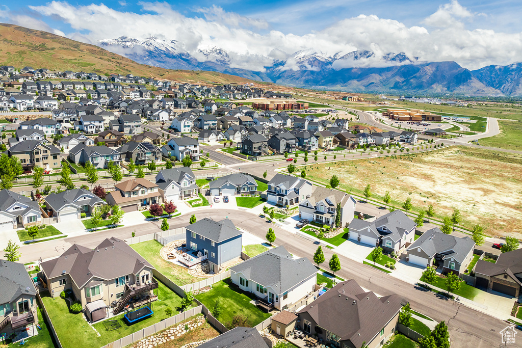 Aerial perspective of suburban area with a mountain backdrop