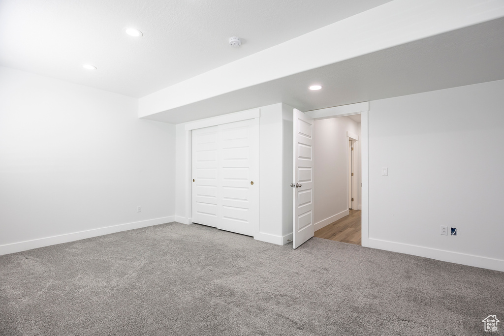 Below grade area featuring carpet, baseboards, and recessed lighting