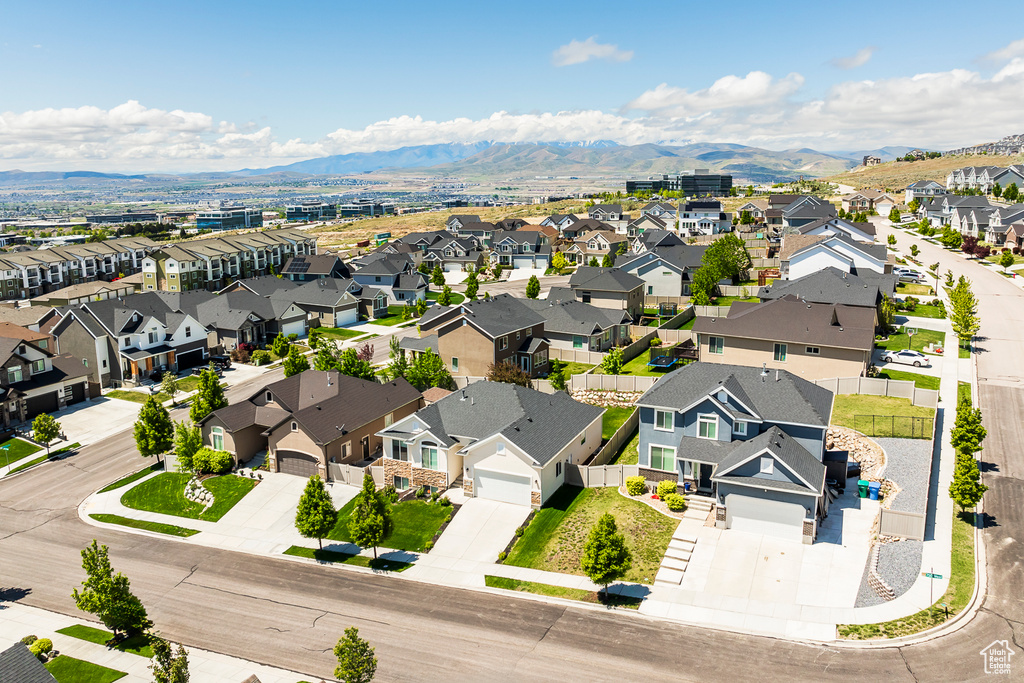 Aerial perspective of suburban area with a mountainous background