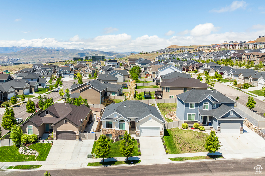 Aerial view of residential area featuring mountains