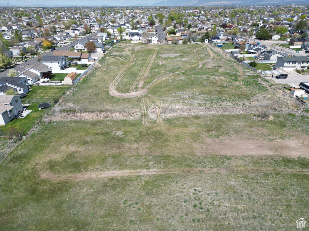 Aerial view of property\'s location with nearby suburban area