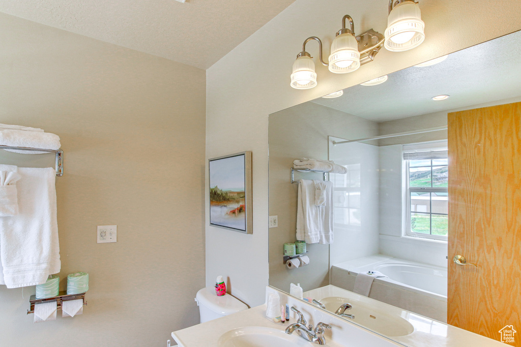 Bathroom featuring toilet and vanity