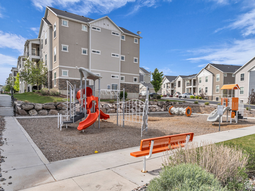 Community jungle gym with a residential view