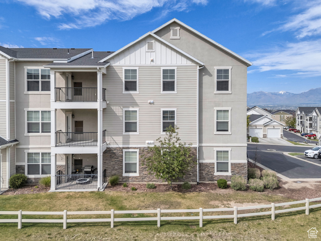 View of property with a mountain view