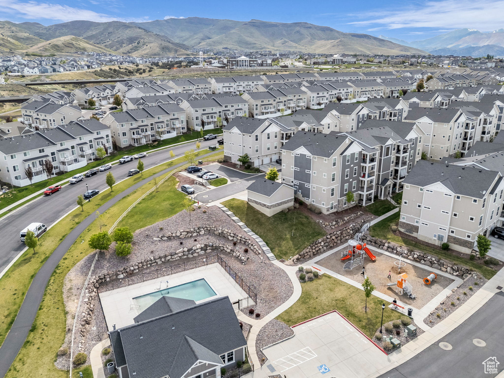 Aerial perspective of suburban area with a mountain backdrop