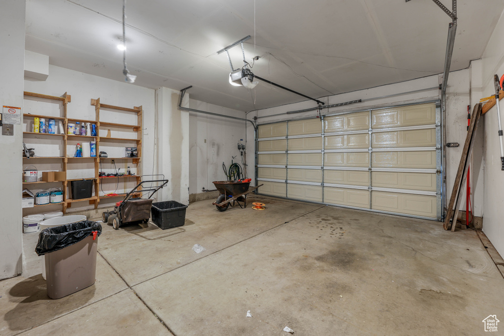 Garage featuring a garage door opener