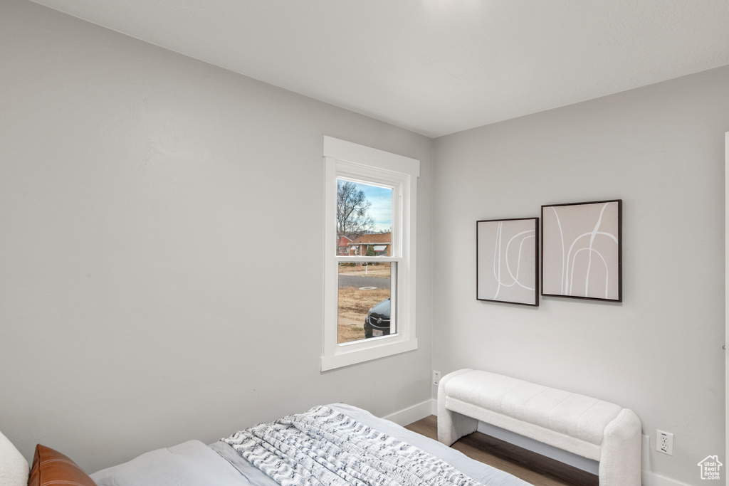 Bedroom featuring baseboards and wood finished floors