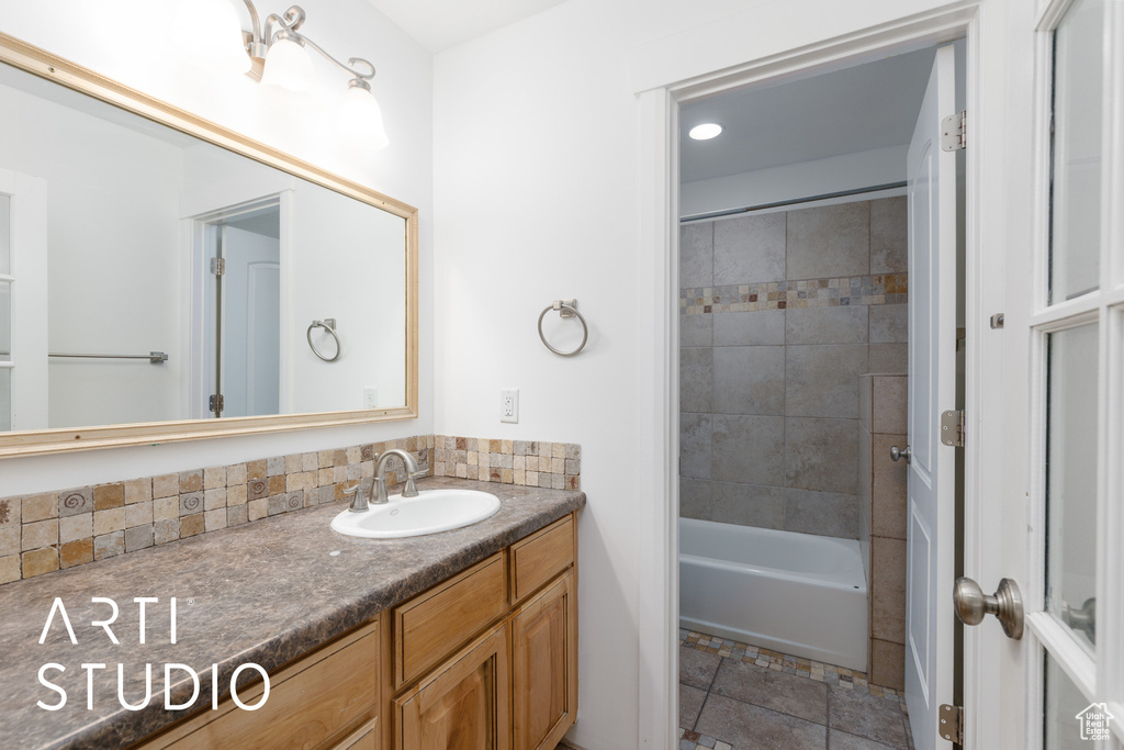Full bath with vanity and shower / bathtub combination