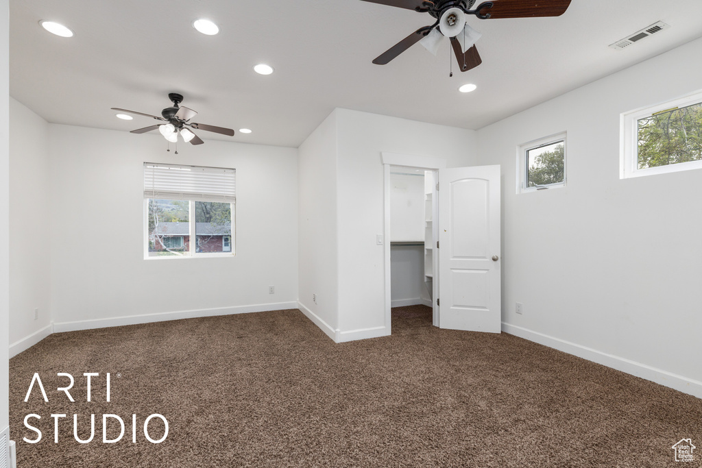 Unfurnished bedroom with carpet flooring, baseboards, visible vents, and recessed lighting