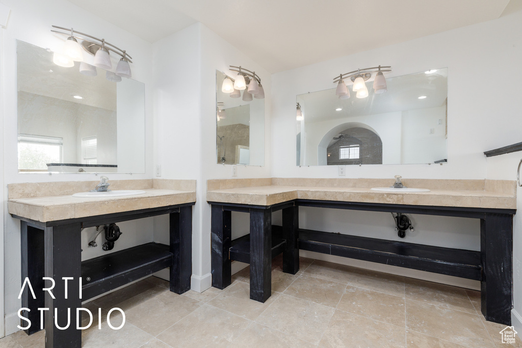 Bathroom with a sink and two vanities