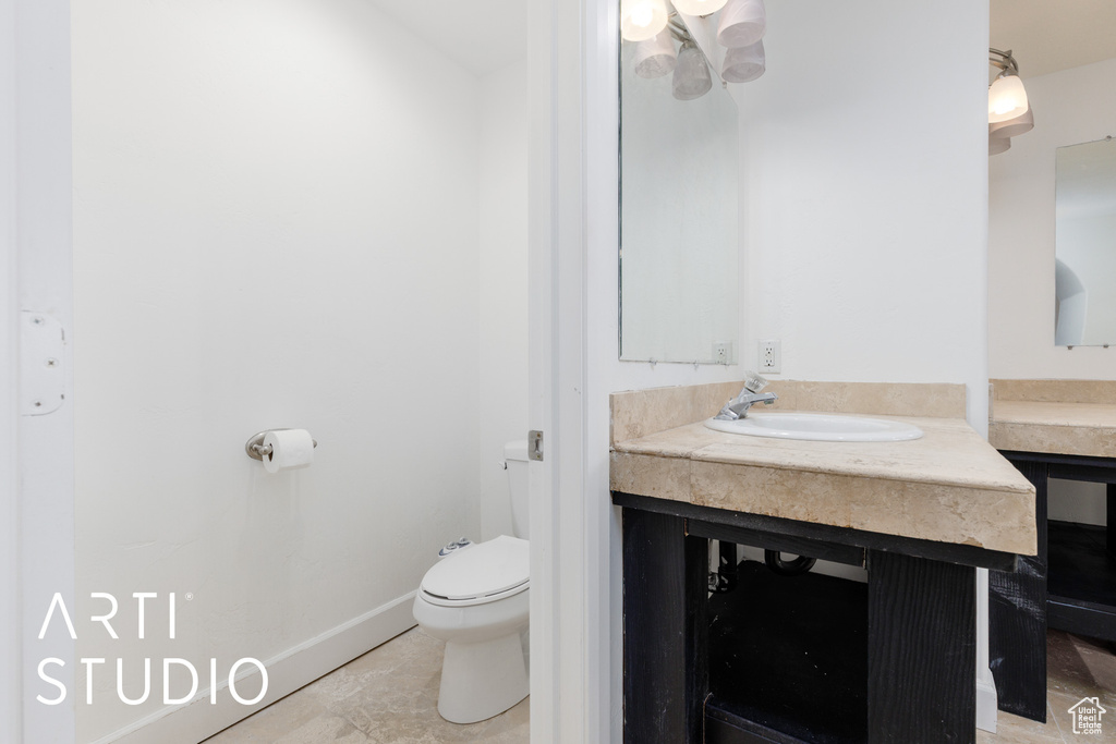 Bathroom with vanity and toilet