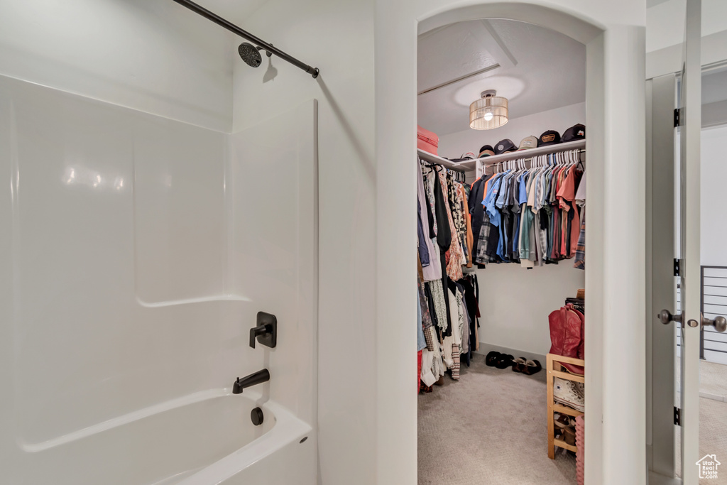 Interior space with shower / bathing tub combination and a walk in closet