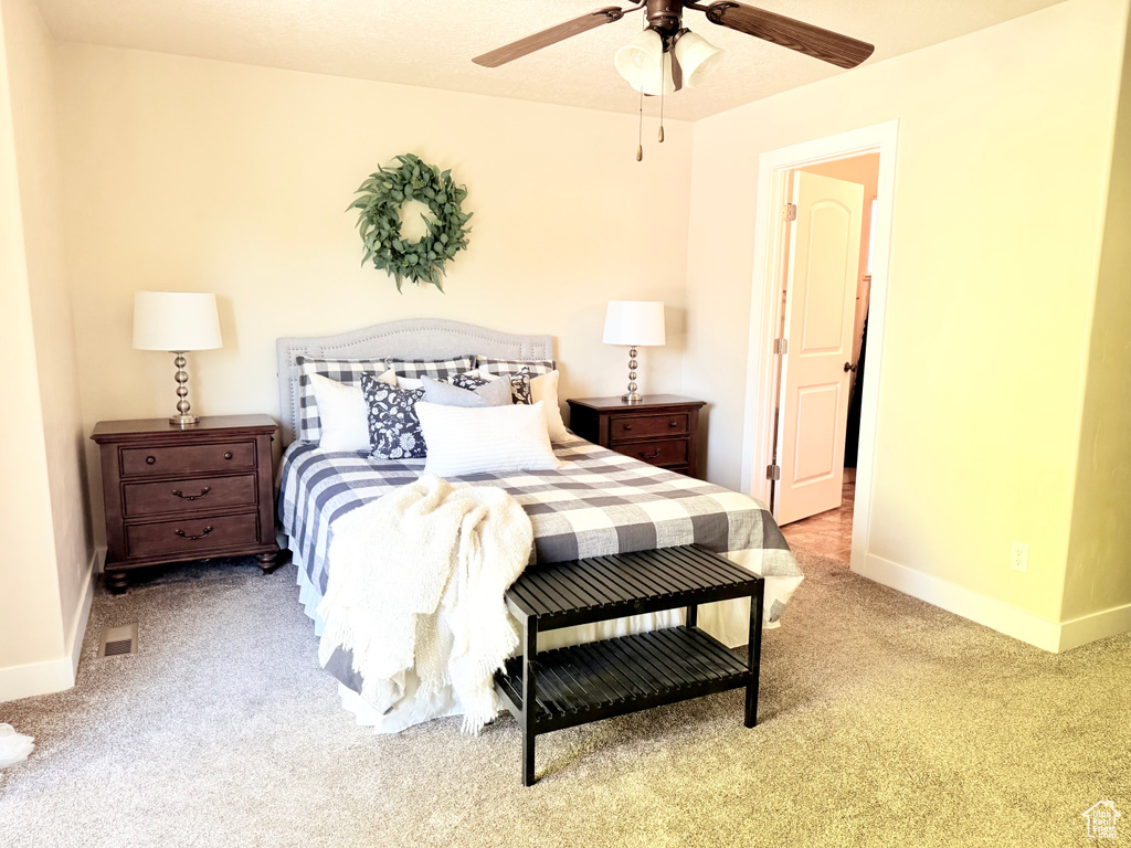 Bedroom with carpet flooring and a ceiling fan