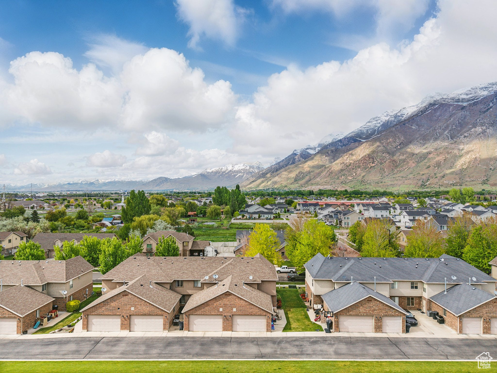Aerial perspective of suburban area featuring a mountain backdrop