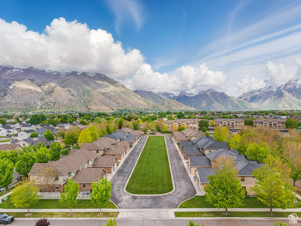 View of mountain backdrop featuring nearby suburban area
