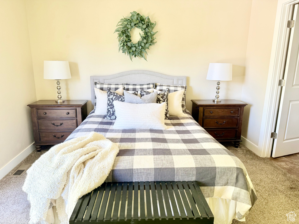 Carpeted bedroom with baseboards