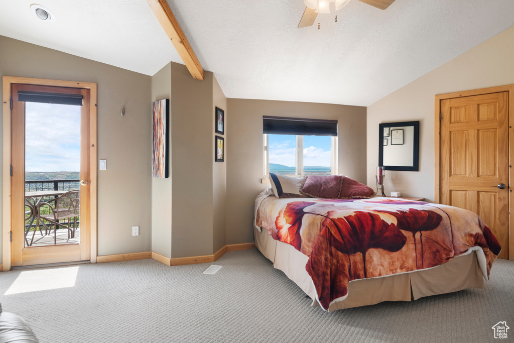 Bedroom featuring vaulted ceiling, access to outside, carpet floors, baseboards, and ceiling fan