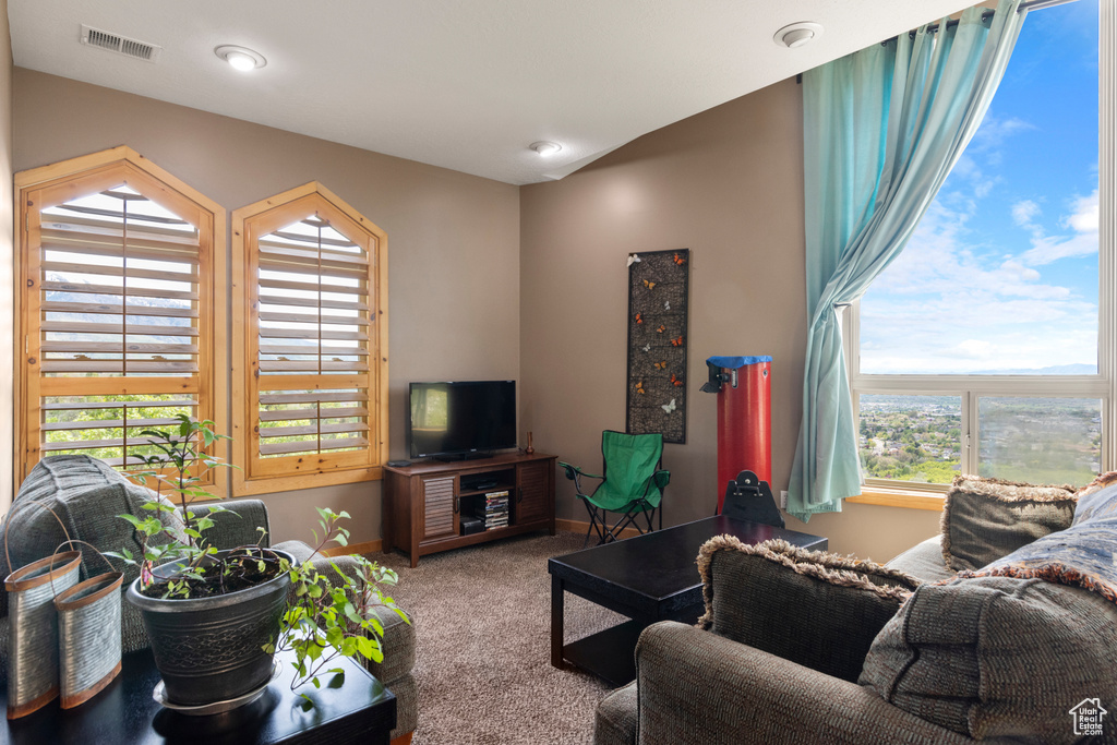 Living room featuring carpet flooring and baseboards