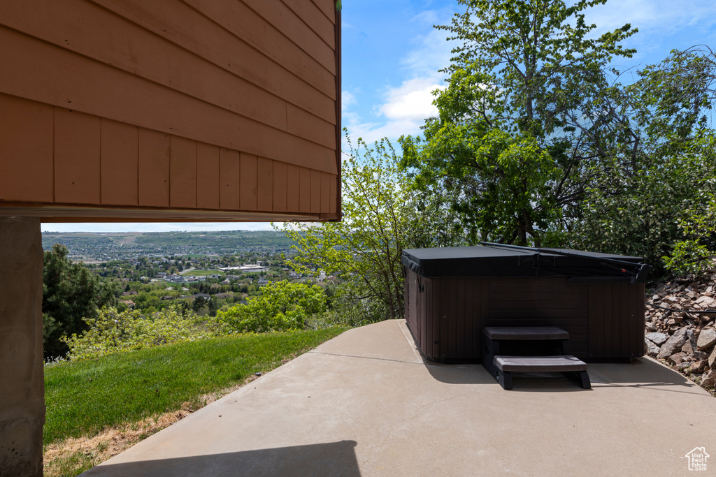 View of patio / terrace featuring a hot tub