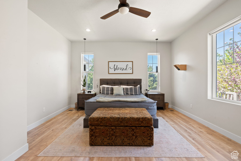 Bedroom featuring baseboards, a ceiling fan, recessed lighting, and wood finished floors