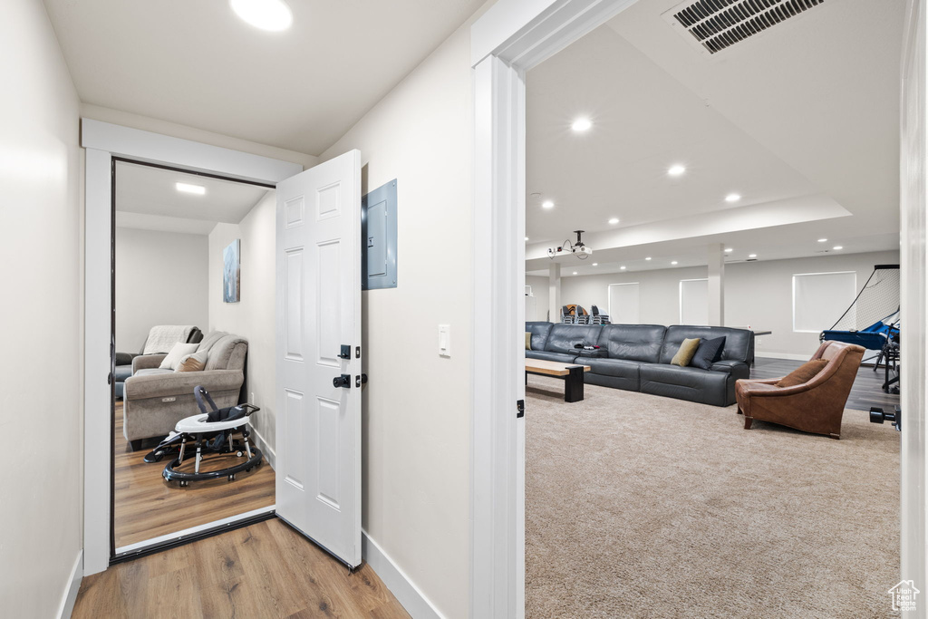 Hall featuring baseboards, recessed lighting, and visible vents