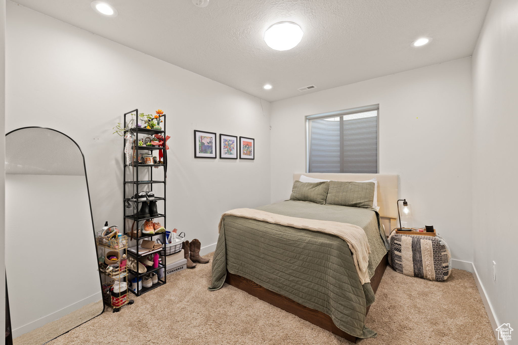Bedroom with carpet flooring, recessed lighting, baseboards, and visible vents