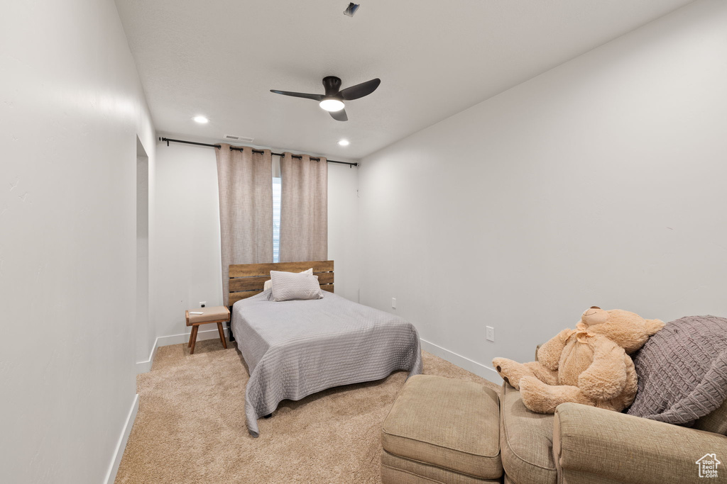 Bedroom with visible vents, baseboards, recessed lighting, light colored carpet, and a ceiling fan