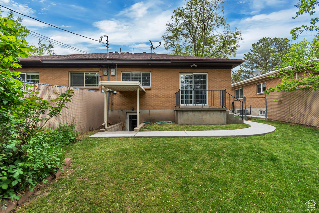 Back of house with brick siding
