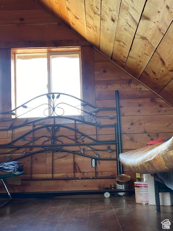 Interior details featuring wood walls and wood ceiling